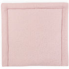 Die KraftKids Wickelauflage Musselin goldene Punkte auf Rosa ist eine weiche, rechteckige Wickelunterlage in zartem Rosa mit einem gepolsterten Rand und kleinen goldenen Punkten.
